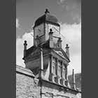 black and white photo of Sundial over Gate of Honour, Gonville and Caius College