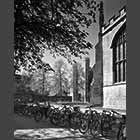 black and white photo of bicycles opposite Trinity College
