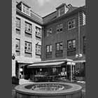 monochrome photo of water fountain in the Quayside courtyard