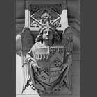 black and white photo of Angelic figure on external wall of King's College