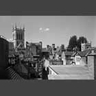 black and white photo of rooftops including St John's Tower and St Clement's Church