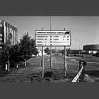 black and white photo of a direction sign at the Biomedical Campus
